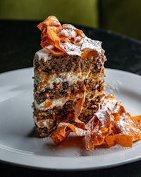 a slice of carrot cake on a plate