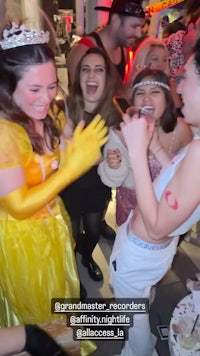 a group of people dressed up as princesses at a party
