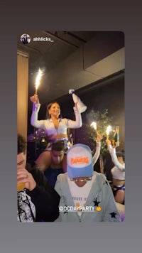 a group of people at a party with sparklers in their hands