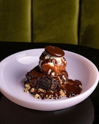 a plate with brownies and ice cream on it